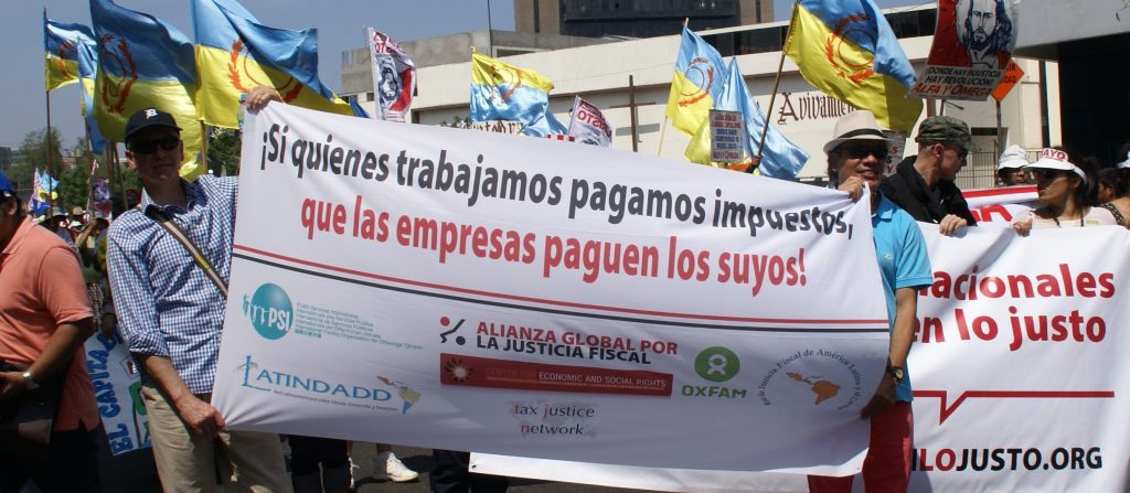 Tax justice activists in Lima, Peru, 1st May 2015 calling on companies to pay their taxes