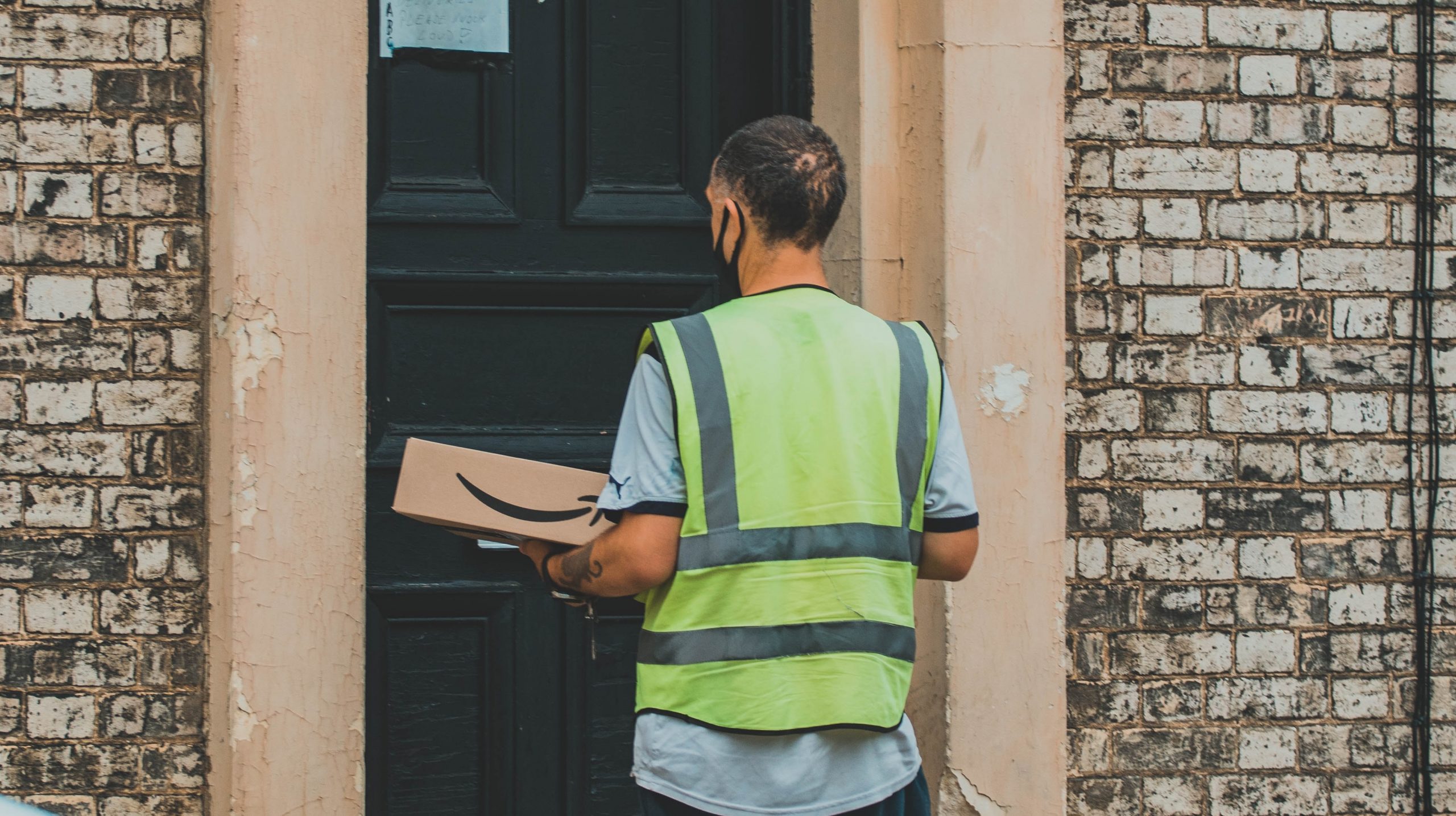 A man delivers an Amazon package