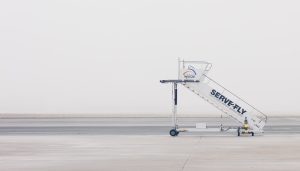 A stairs truck parked on an empty airport tarmac