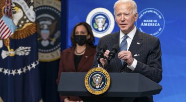 President Joe Biden speaks from a podium