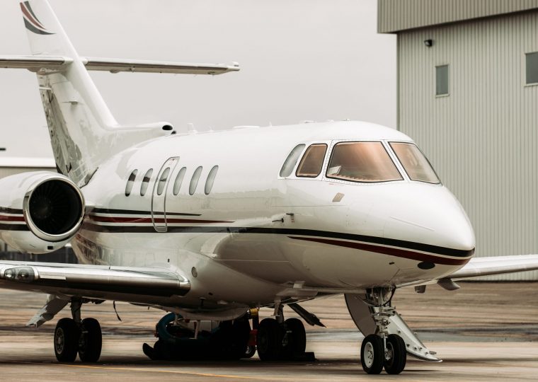 Private jet on the tarmac on a grey cloudy day