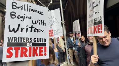WGA writes strike and carry placards on location