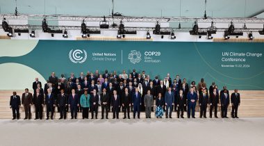 World leaders pose for a group photo at COP29