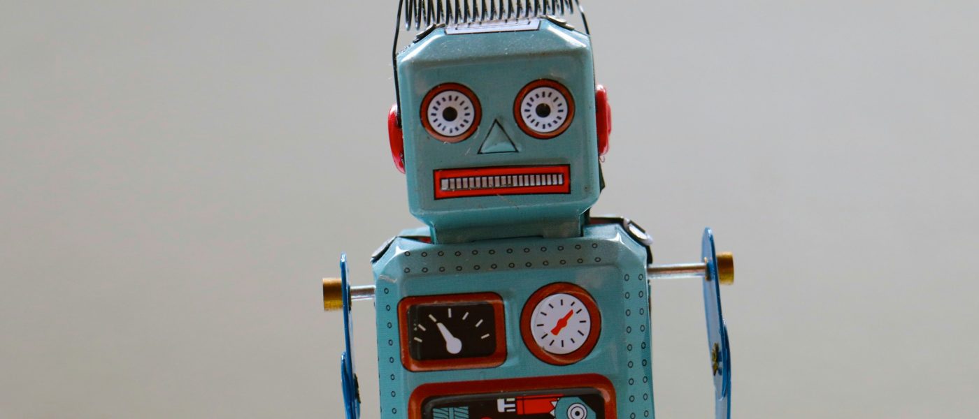 A blue and red toy robot - UNSPLASH A blue and red toy robot