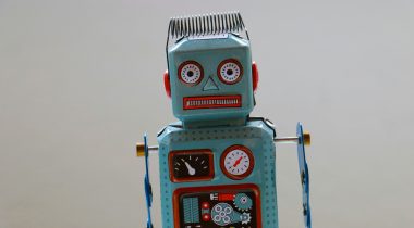 A blue and red toy robot - UNSPLASH A blue and red toy robot