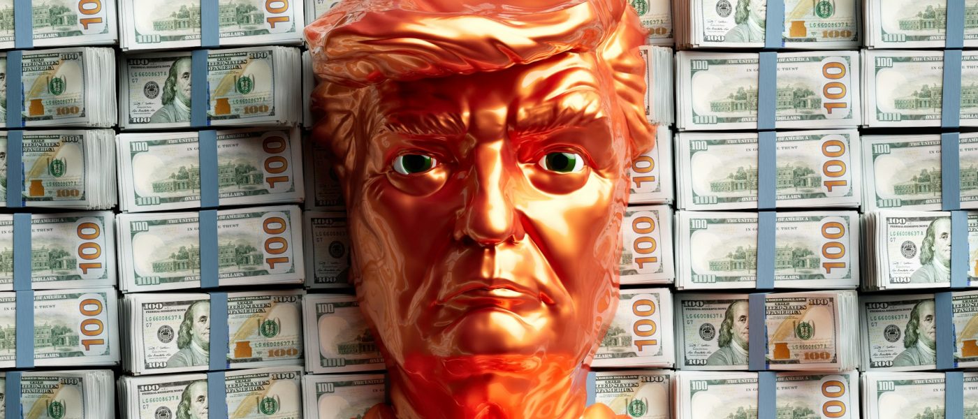 A golden Trump figure head stands before stacks of money - UNSPLASH A golden Trump figure head stands before stacks of money