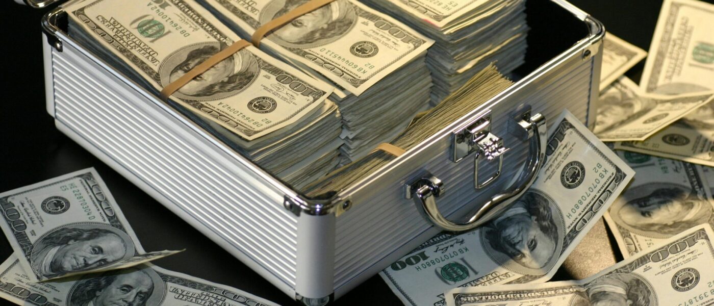 An open metal briefcase containing stacks of hunderd dollar bills - PEXELS An opened metal briefcase containing stacks of hundred dollar bills