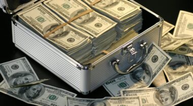 An open metal briefcase containing stacks of hunderd dollar bills - PEXELS An opened metal briefcase containing stacks of hundred dollar bills