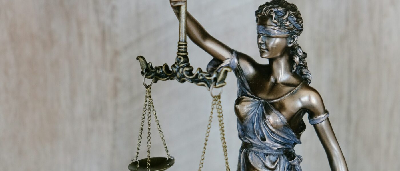 A statue of lady justice holding scales and a sword - UNSPLASH A statue of lady justice holding scales and a sword